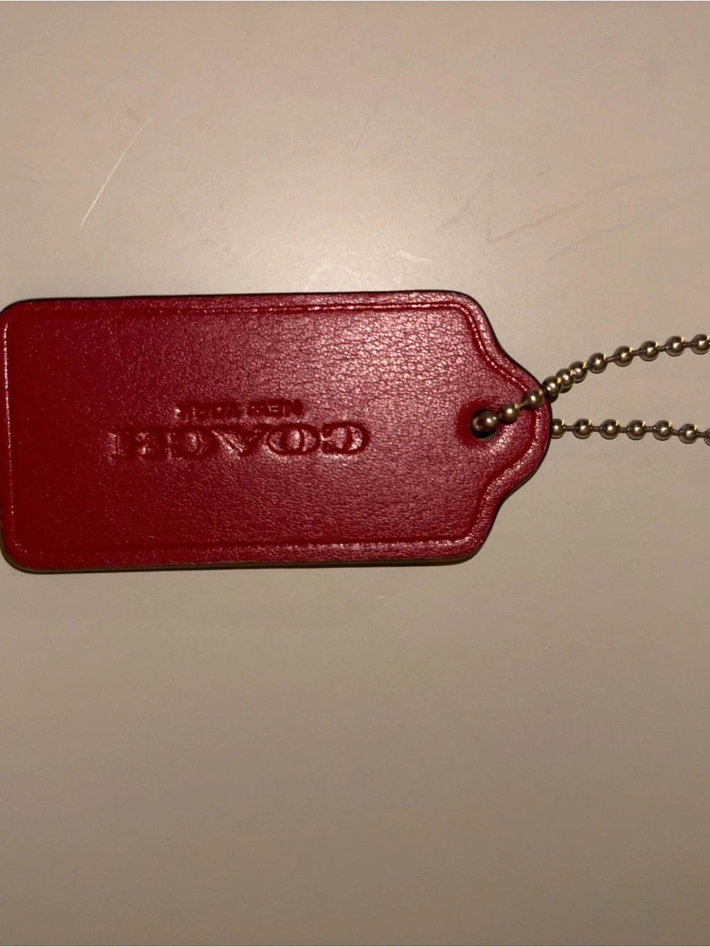 Coach branded red